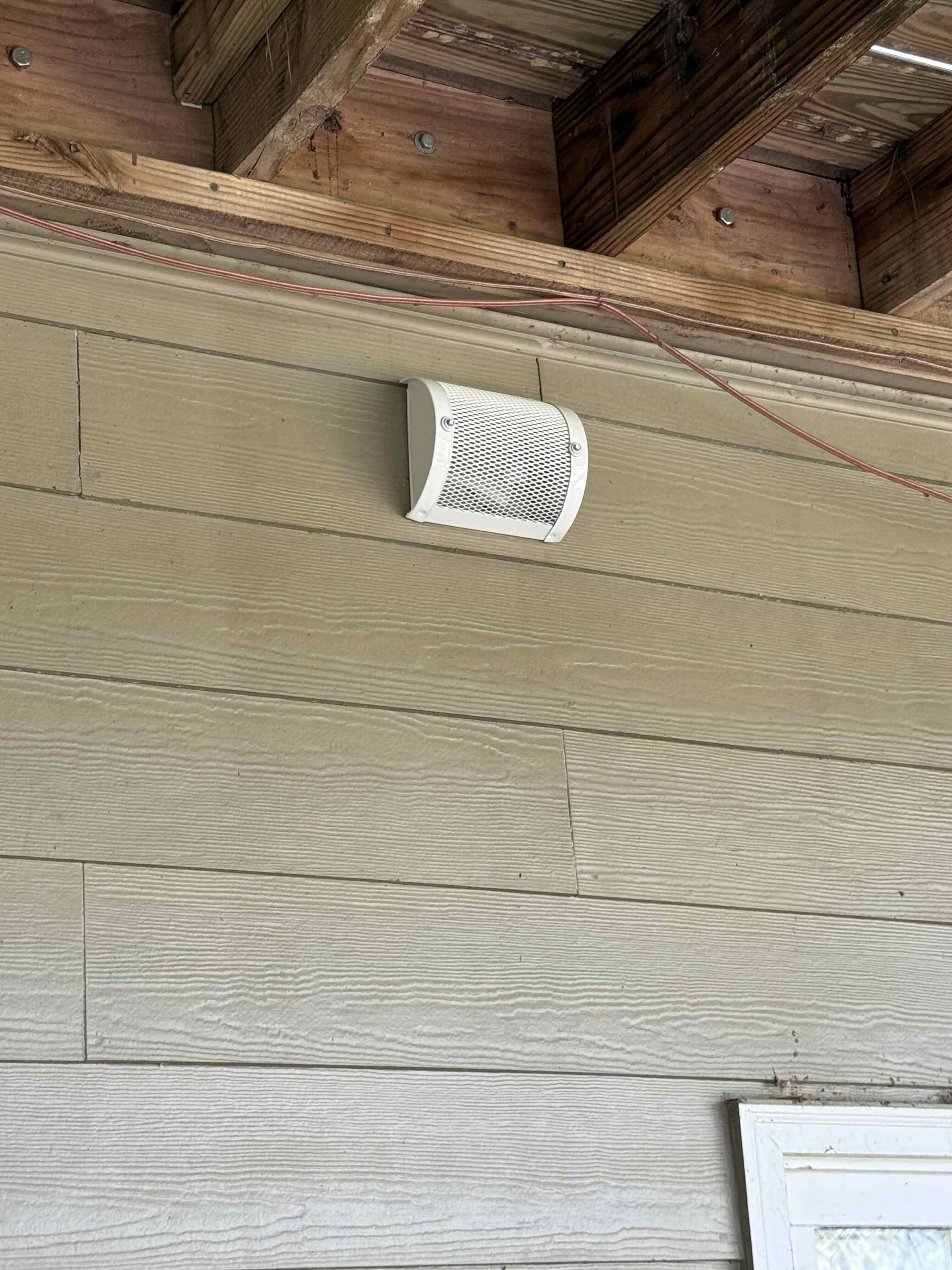 Wall vent guard installed to prevent bird nesting and wildlife entry